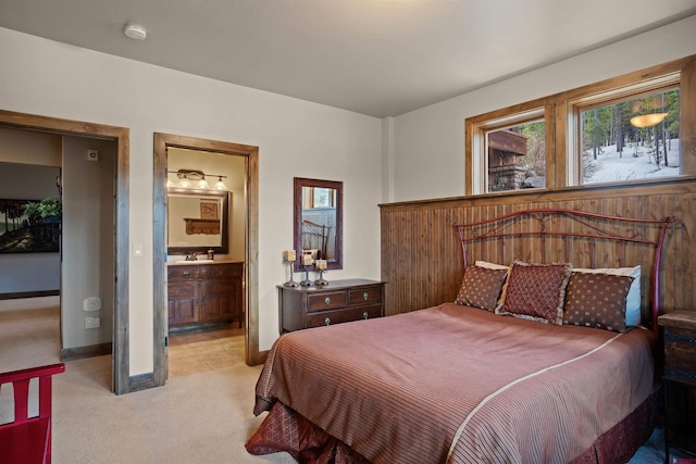 carpeted bedroom with ensuite bath