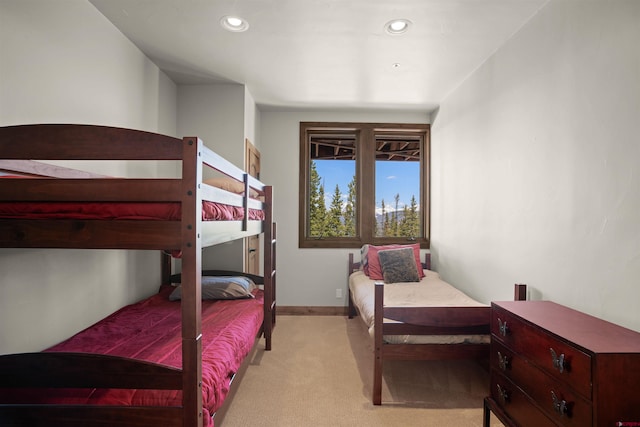 bedroom featuring light carpet