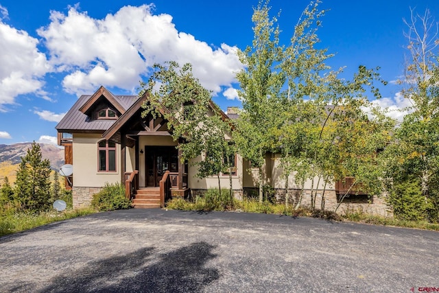 view of front of property with a mountain view