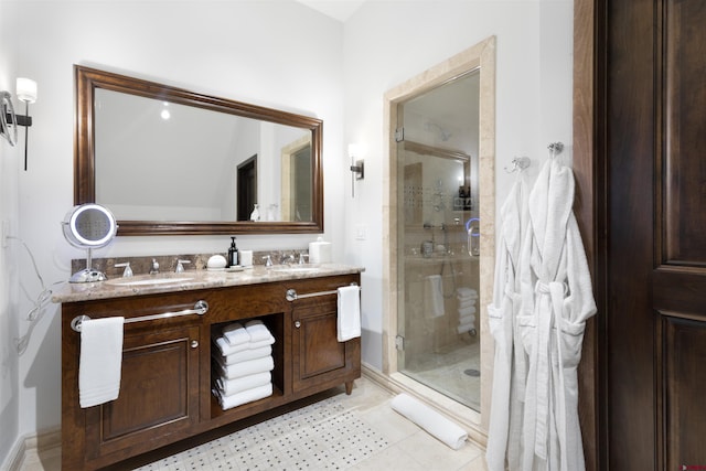 bathroom featuring vanity, an enclosed shower, and tile patterned flooring