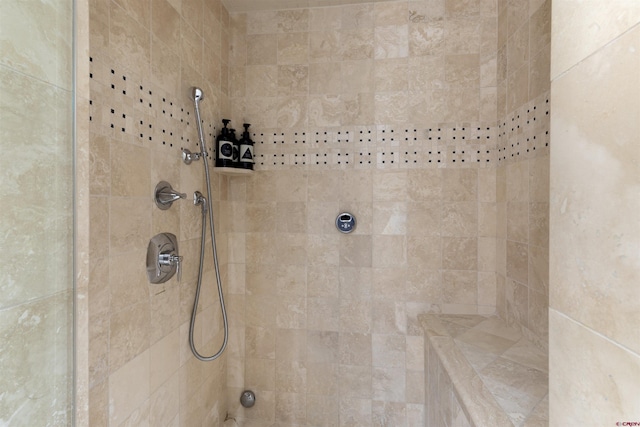 bathroom featuring tiled shower