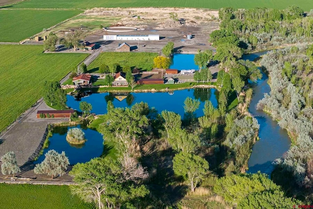 aerial view featuring a rural view and a water view