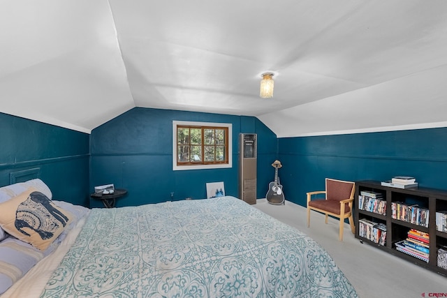 bedroom with carpet flooring and lofted ceiling