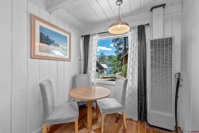 dining space with hardwood / wood-style flooring