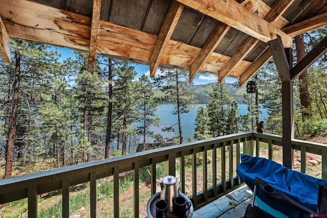 deck featuring a grill and a water view