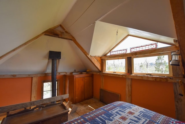 bedroom with lofted ceiling and hardwood / wood-style flooring