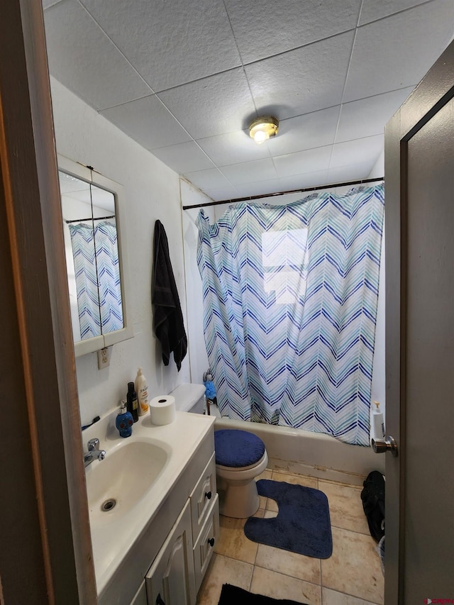 full bathroom featuring shower / bathtub combination with curtain, tile flooring, toilet, and vanity