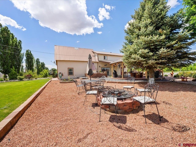 view of yard featuring a patio and a fire pit