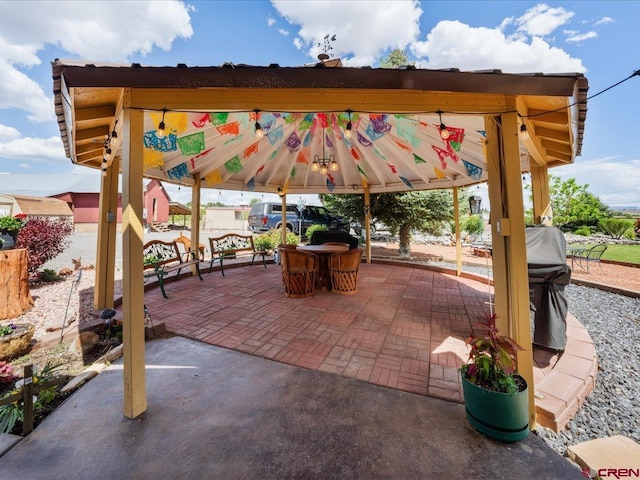 view of terrace with a gazebo and a grill