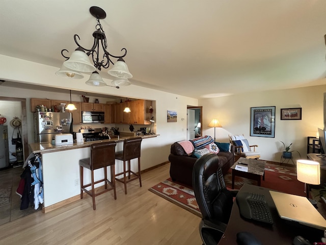 living room with light wood-type flooring, an inviting chandelier, and water heater