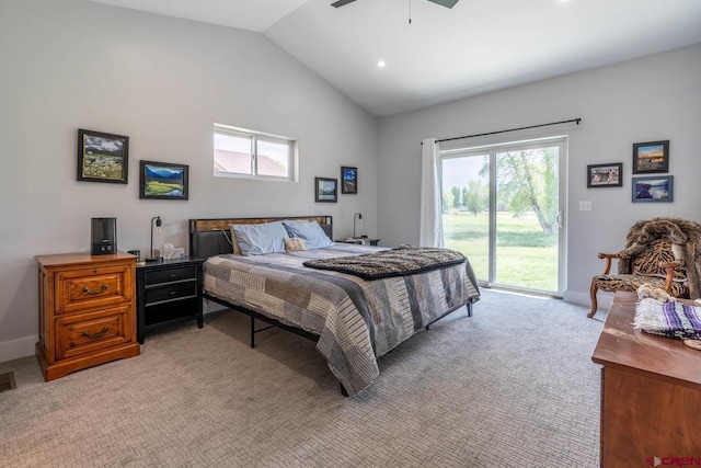 carpeted bedroom featuring ceiling fan, lofted ceiling, access to outside, and multiple windows