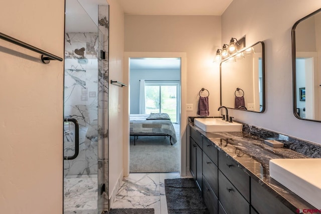 bathroom featuring vanity and an enclosed shower