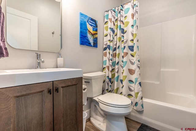 full bathroom with shower / bath combination with curtain, vanity, hardwood / wood-style flooring, and toilet