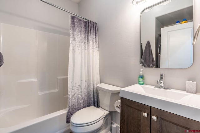 full bathroom with shower / tub combo, vanity, and toilet