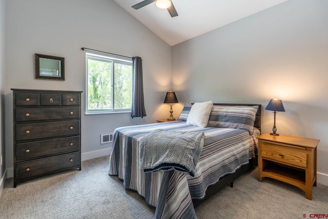 bedroom featuring light carpet, vaulted ceiling, and ceiling fan