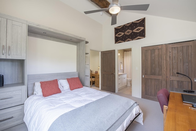 carpeted bedroom featuring connected bathroom, high vaulted ceiling, and ceiling fan