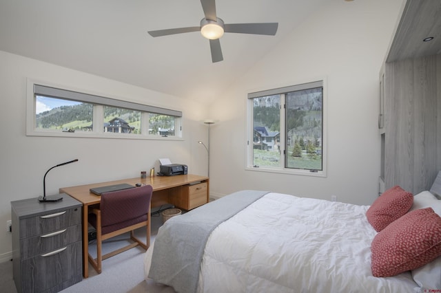 carpeted bedroom with ceiling fan and lofted ceiling