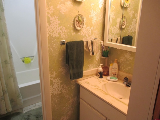 bathroom with shower / bathtub combination with curtain and vanity