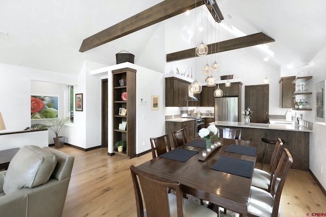 dining room featuring beam ceiling, baseboards, high vaulted ceiling, and light wood-style floors