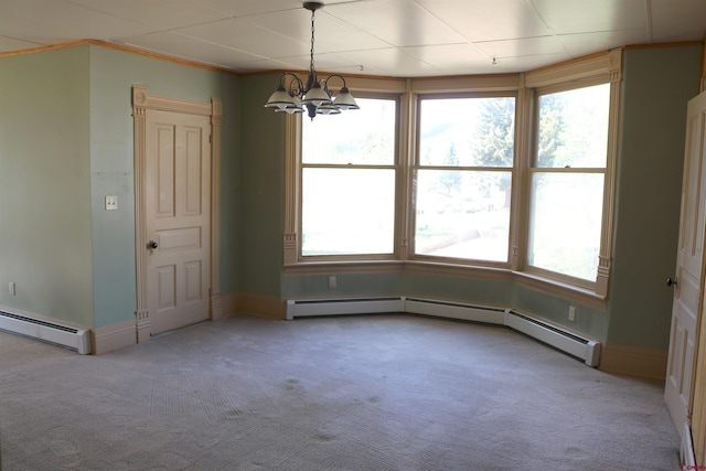 unfurnished dining area with a baseboard heating unit, a chandelier, carpet, and plenty of natural light