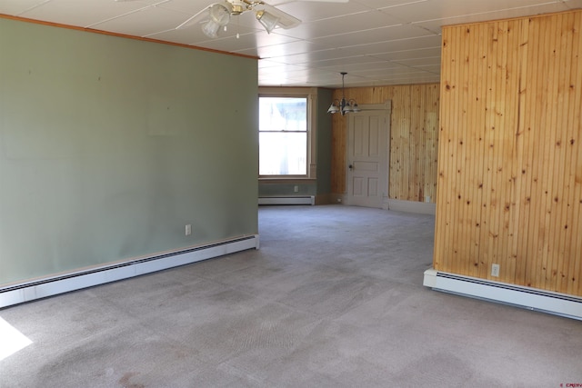 unfurnished room with ceiling fan, a baseboard radiator, and carpet flooring