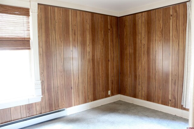 spare room featuring plenty of natural light and baseboard heating