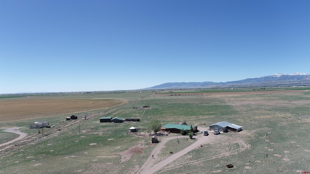 bird's eye view featuring a rural view and a mountain view