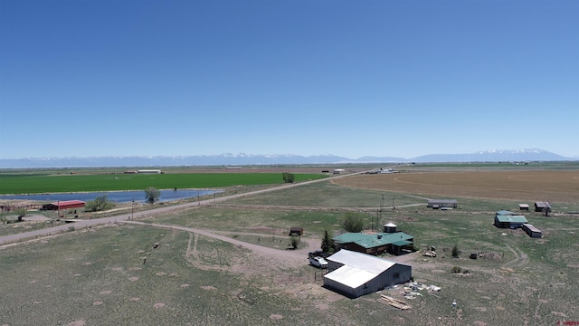 bird's eye view featuring a rural view and a mountain view