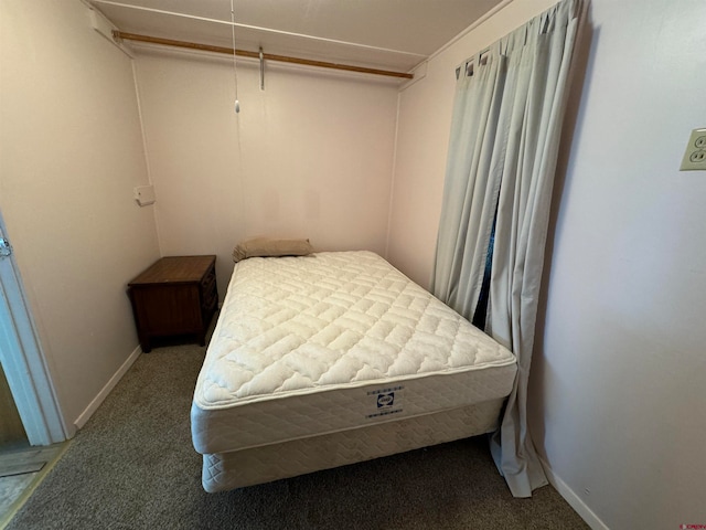 carpeted bedroom with a closet