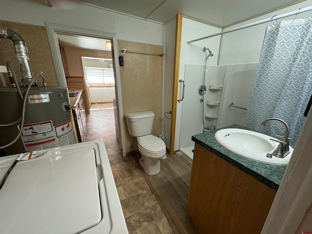 bathroom with vanity, toilet, tile floors, and gas water heater