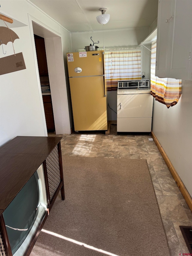 washroom with light carpet and washer / dryer