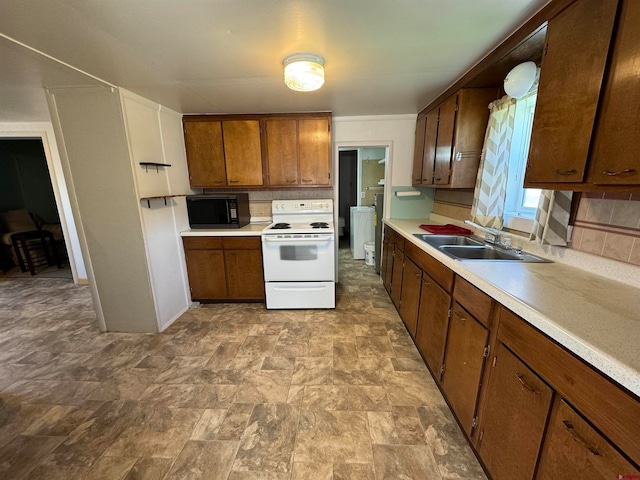 kitchen with sink, white electric stove, light tile floors, and backsplash