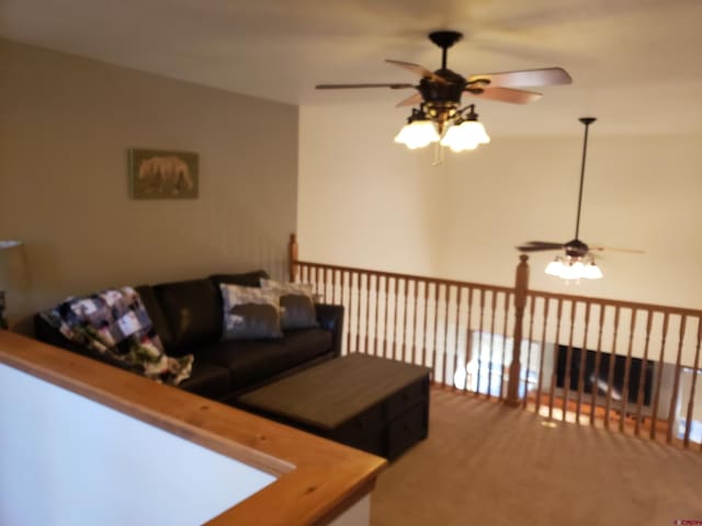 living room with carpet flooring and ceiling fan