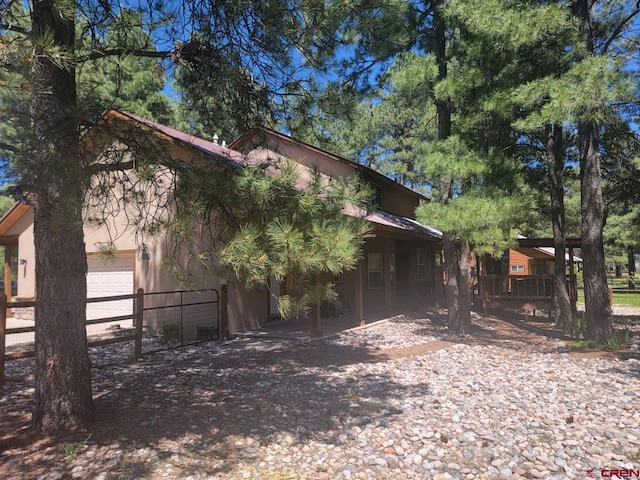 view of property exterior featuring a garage