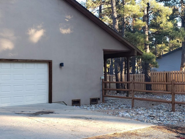 view of side of home with a garage