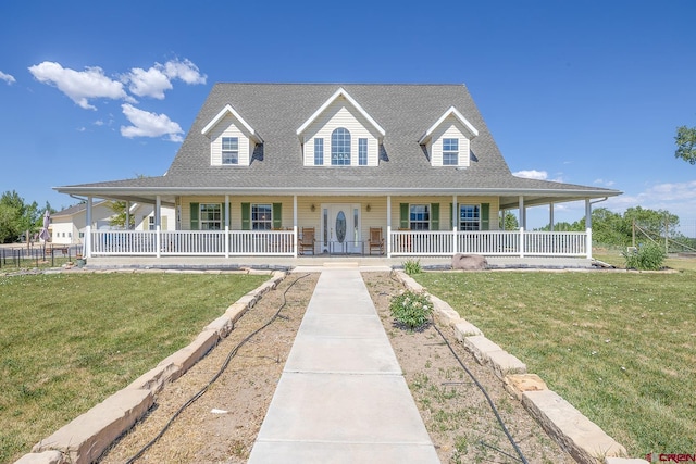 farmhouse with covered porch and a front yard