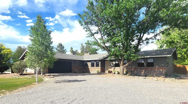 ranch-style home featuring a garage