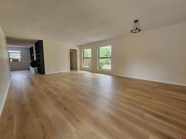 unfurnished living room with light wood-type flooring