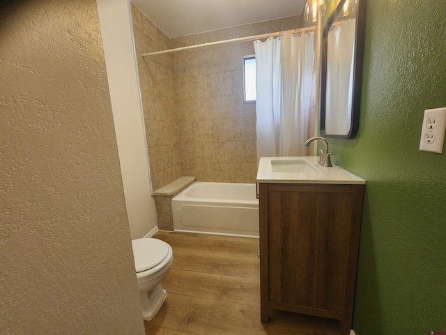 full bathroom with hardwood / wood-style floors, toilet, vanity, and shower / bath combination with curtain