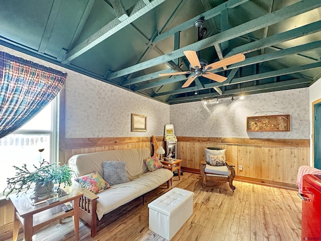 living room featuring ceiling fan, track lighting, vaulted ceiling, and hardwood / wood-style flooring