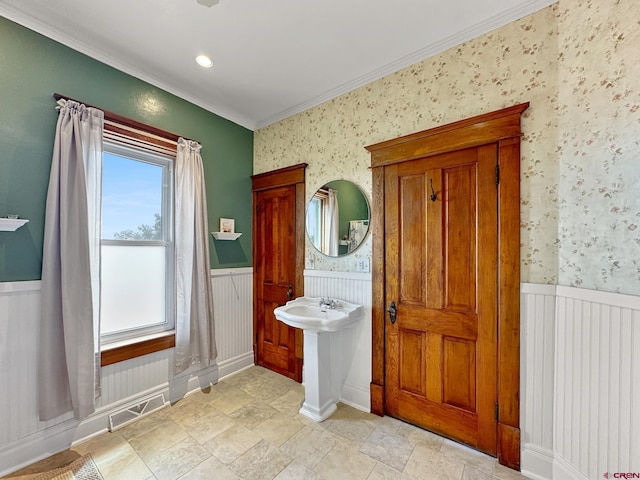 bathroom featuring crown molding