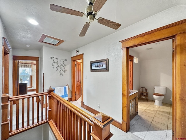 hallway featuring light tile patterned floors