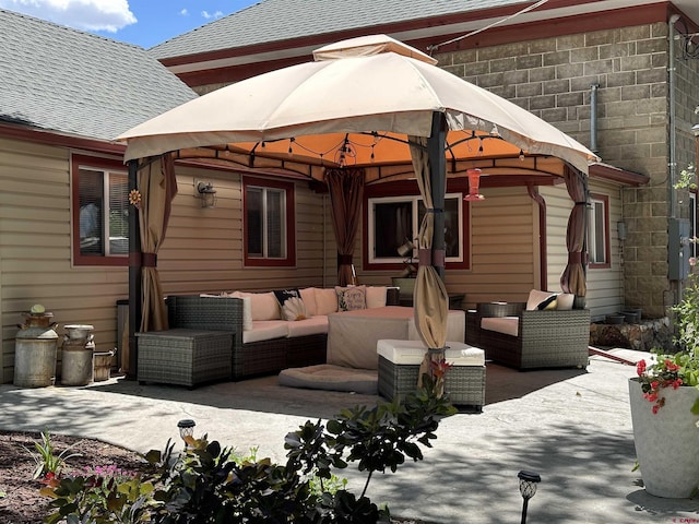 view of patio with a gazebo and an outdoor living space