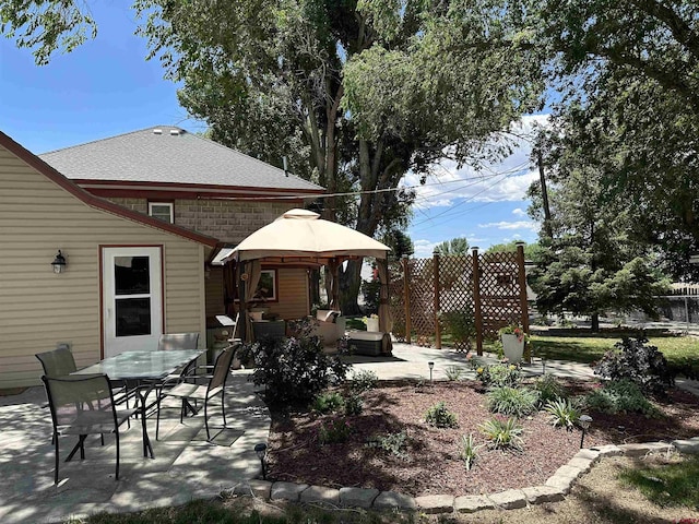 view of patio featuring outdoor lounge area and a gazebo