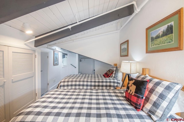 bedroom with wooden ceiling, beamed ceiling, and carpet