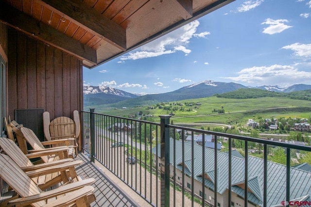 balcony featuring a mountain view and a rural view