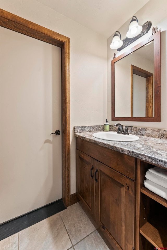 bathroom with tile floors and large vanity