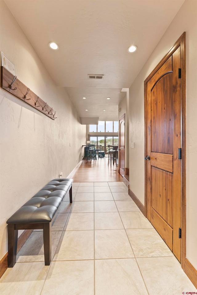 corridor featuring light tile flooring