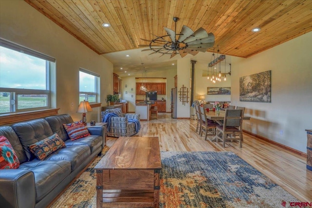 living room with ceiling fan, lofted ceiling, light hardwood / wood-style floors, and wooden ceiling