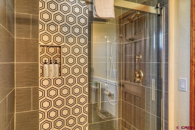 bathroom with a tile shower